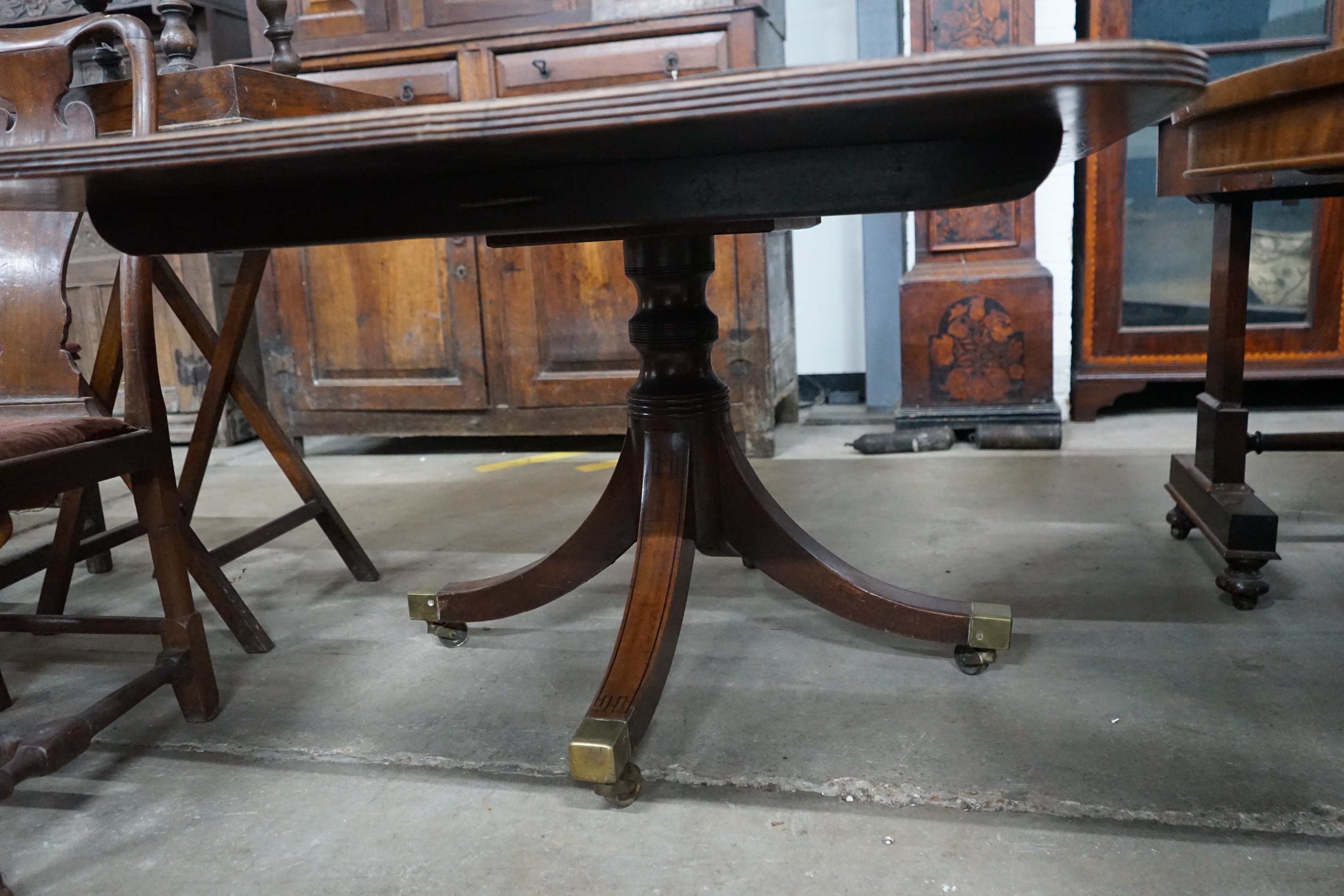 A George III satinwood banded rectangular mahogany tilt top dining table, length 152cm, depth 104cm, height 70cm